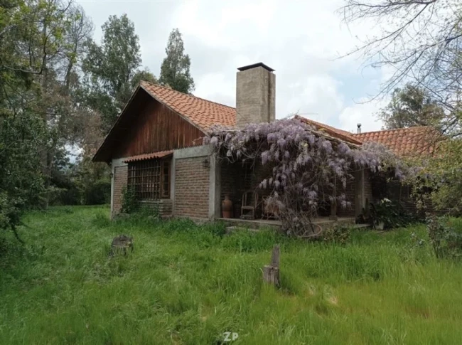 Venta de Parcela con Casa Estilo Colonial
