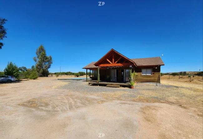 PARCELA CON HERMOSA CASA REGULARIZADA