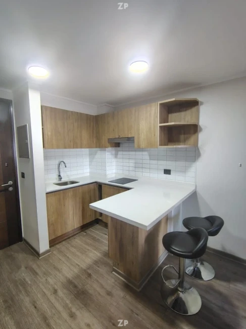 Departamento, completamente equipado con cocina que contiene horno campana