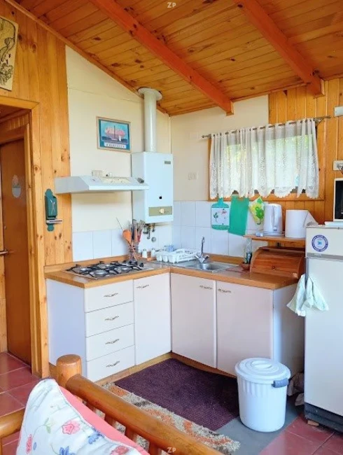 Parcela en venta de 5.749 m² con casa, piscina y quincho en condominio