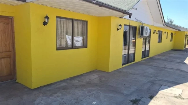 Parcela en venta con casa de 4 dormitorios, bodegas y árboles frutales