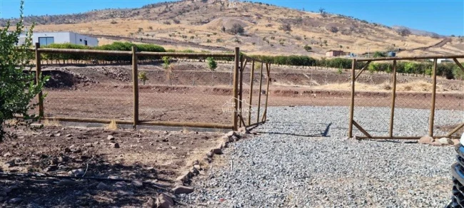Parcela en venta de 5.091 m² con cierre perimetral y árboles frutales