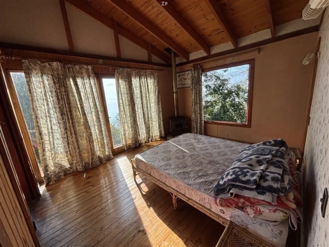 Parcela en venta de 6.000 m² con 2 cabañas, acceso a Laguna Aculeo y vista privi