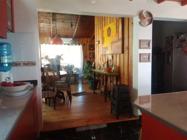 Parcela en venta de 5.600 m² con casa de madera, jacuzzi y árboles frutales