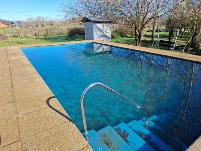 PARCELA 1 HA + 2 CASAS + PISCINA + RÍO | $150.000.000